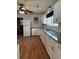 Bright kitchen featuring white cabinetry, gray countertops, and modern appliances at 7724 Linsley Dr, North Charleston, SC 29418