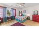Bright bedroom featuring a ceiling fan, wood floors, large window, and charming decor at 8 Duffers Ct. # A, Charleston, SC 29414