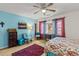 Well-lit bedroom with hardwood floors, complemented by unique decor and colorful curtains at 8 Duffers Ct. # A, Charleston, SC 29414