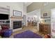Open living space with a decorative fireplace and easy access to the dining area at 8 Duffers Ct. # A, Charleston, SC 29414