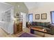 Inviting living area with a comfortable sofa, hardwood floors, and a vaulted ceiling at 8 Duffers Ct. # A, Charleston, SC 29414