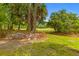 Expansive yard featuring lush greenery and trees, offering a serene and natural setting at 8 Duffers Ct. # A, Charleston, SC 29414