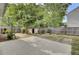 Fenced backyard featuring a storage shed and mature trees with lush greenery at 8001 Hydrangea Ln, Hanahan, SC 29410