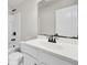Bathroom featuring a white vanity, black hardware, toilet, and shower/tub combination at 8001 Hydrangea Ln, Hanahan, SC 29410