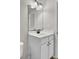 Bathroom featuring a white vanity, black hardware, toilet, framed mirror and accessories at 8001 Hydrangea Ln, Hanahan, SC 29410