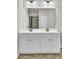 Bathroom features a double vanity and a large mirror at 8001 Hydrangea Ln, Hanahan, SC 29410