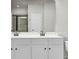 Bathroom features a double vanity and a large mirror at 8001 Hydrangea Ln, Hanahan, SC 29410
