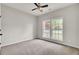 Bedroom with a ceiling fan and large windows at 8001 Hydrangea Ln, Hanahan, SC 29410