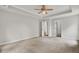 Spacious bedroom with a ceiling fan and neutral carpeting at 8001 Hydrangea Ln, Hanahan, SC 29410