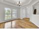 Formal dining room featuring hardwood floors, an elegant chandelier, and plenty of natural light at 8001 Hydrangea Ln, Hanahan, SC 29410