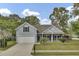Charming single-Gathering home featuring a well-manicured lawn, attached garage, and beautiful landscaping at 8001 Hydrangea Ln, Hanahan, SC 29410
