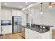 Bright kitchen featuring stainless steel appliances, granite countertops, and an open layout at 8001 Hydrangea Ln, Hanahan, SC 29410