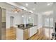 Bright kitchen area showcasing stainless appliances, granite countertops, and an eat-in bar area at 8001 Hydrangea Ln, Hanahan, SC 29410