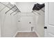 Functional laundry room with built-in shelving units for storage at 8001 Hydrangea Ln, Hanahan, SC 29410