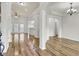 Open-concept living room showcasing hardwood floors, natural light, and elegant archway details at 8001 Hydrangea Ln, Hanahan, SC 29410