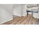 Spacious living area showing hardwood floors and an open layout that leads to the kitchen at 8001 Hydrangea Ln, Hanahan, SC 29410