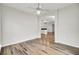 Spacious living room with hardwood floors and a view of the kitchen at 8001 Hydrangea Ln, Hanahan, SC 29410