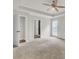 Spacious main bedroom with double doors and tray ceiling at 8001 Hydrangea Ln, Hanahan, SC 29410