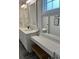 Bathroom featuring white cabinets, double sinks, vanity, and stylish lighting at 928 Sycamore Ave, Charleston, SC 29407