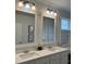 Bathroom featuring double sinks, vanity, and stylish light fixtures at 928 Sycamore Ave, Charleston, SC 29407