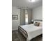 Cozy bedroom featuring neutral tones, a comfortable bed, and stylish decor at 928 Sycamore Ave, Charleston, SC 29407
