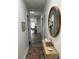 Bright hallway featuring wood floors, a decorative mirror, and stylish console table at 928 Sycamore Ave, Charleston, SC 29407