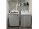 Convenient laundry room with modern, full-sized washer and dryer, and storage shelf at 928 Sycamore Ave, Charleston, SC 29407