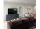 Comfortable living room with a large TV, stylish furniture, and neutral colors at 928 Sycamore Ave, Charleston, SC 29407