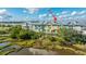 Scenic aerial view of the back of colorful townhomes overlooking a marshy landscape and waterway at 1011 Lighterman Way, Charleston, SC 29412