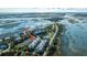 Stunning aerial view of charming coastal community with waterfront homes and tranquil marsh views at 1011 Lighterman Way, Charleston, SC 29412