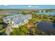 Lovely aerial view of waterfront townhomes featuring balconies overlooking the serene marsh at 1011 Lighterman Way, Charleston, SC 29412