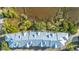 Overhead aerial view of townhomes with metal roofs nestled next to marshy areas and trees at 1011 Lighterman Way, Charleston, SC 29412