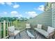 Inviting back deck with comfortable seating and scenic water views at 1011 Lighterman Way, Charleston, SC 29412