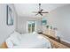Comfortable bedroom boasts modern decor, hardwood floors, and a television at 1011 Lighterman Way, Charleston, SC 29412