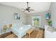 Cozy bedroom featuring a ceiling fan and exterior access to a balcony at 1011 Lighterman Way, Charleston, SC 29412