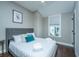 Cozy bedroom with a plush queen-sized bed, soft linens, and a bright window at 1011 Lighterman Way, Charleston, SC 29412