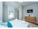 Comfortable bedroom featuring a plush queen-sized bed and natural light from the windows at 1011 Lighterman Way, Charleston, SC 29412