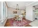 Dining room with wood table, chairs, and bench seating with great light and kitchen access at 1011 Lighterman Way, Charleston, SC 29412
