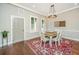 Dining room with a wood table, six chairs, overhead lighting, and a decorative rug at 1011 Lighterman Way, Charleston, SC 29412
