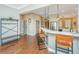 Kitchen with granite countertops, stainless steel appliances, and seating at the bar and into the living area at 1011 Lighterman Way, Charleston, SC 29412