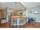 Charming kitchen featuring a breakfast bar, stainless steel appliances, and elegant pendant lighting at 1011 Lighterman Way, Charleston, SC 29412