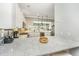 A kitchen with granite countertops, white cabinets, stainless steel appliances, and an open layout at 1011 Lighterman Way, Charleston, SC 29412