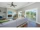 Modern living room featuring a fireplace, high ceilings, hardwood floors, and access to a deck at 1011 Lighterman Way, Charleston, SC 29412