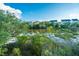 Scenic view of marsh, trees, and nearby houses under a clear blue sky at 1011 Lighterman Way, Charleston, SC 29412