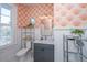 Stylish bathroom with patterned wallpaper, vanity, and ample storage at 1075 Avenue Of Oaks, Charleston, SC 29407