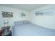 Cozy bedroom with striped bedding, beach themed decor, and a decorative side table with lamp at 1075 Avenue Of Oaks, Charleston, SC 29407