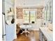 Eat-in kitchen features charming breakfast nook with a round table and window at 1075 Avenue Of Oaks, Charleston, SC 29407