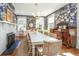 Dining room with blue wallpaper, a decorative fireplace, and a long table for gathering, and bright natural light at 1075 Avenue Of Oaks, Charleston, SC 29407