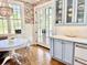 Bright eat-in kitchen features beautiful floral wallpaper and wood floors at 1075 Avenue Of Oaks, Charleston, SC 29407