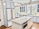 Bright and modern kitchen with a large center island, stainless steel appliances, and ample cabinet space at 1075 Avenue Of Oaks, Charleston, SC 29407